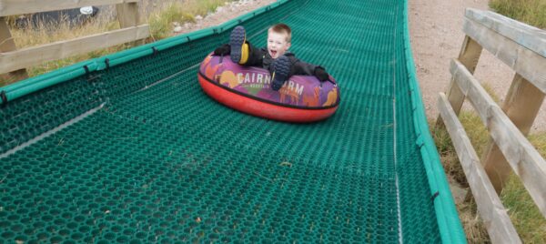 Young child on tubing slide