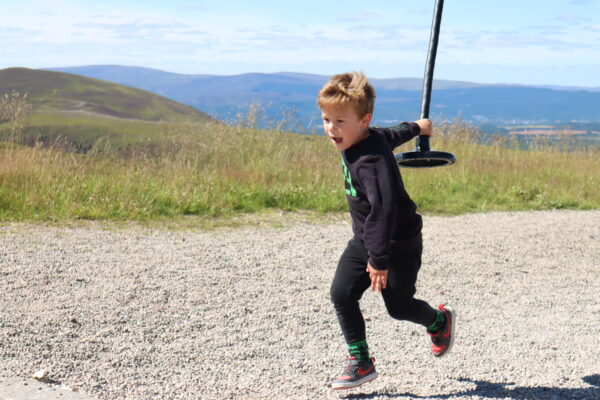 Boy at zip line at Cairngorm Mountain