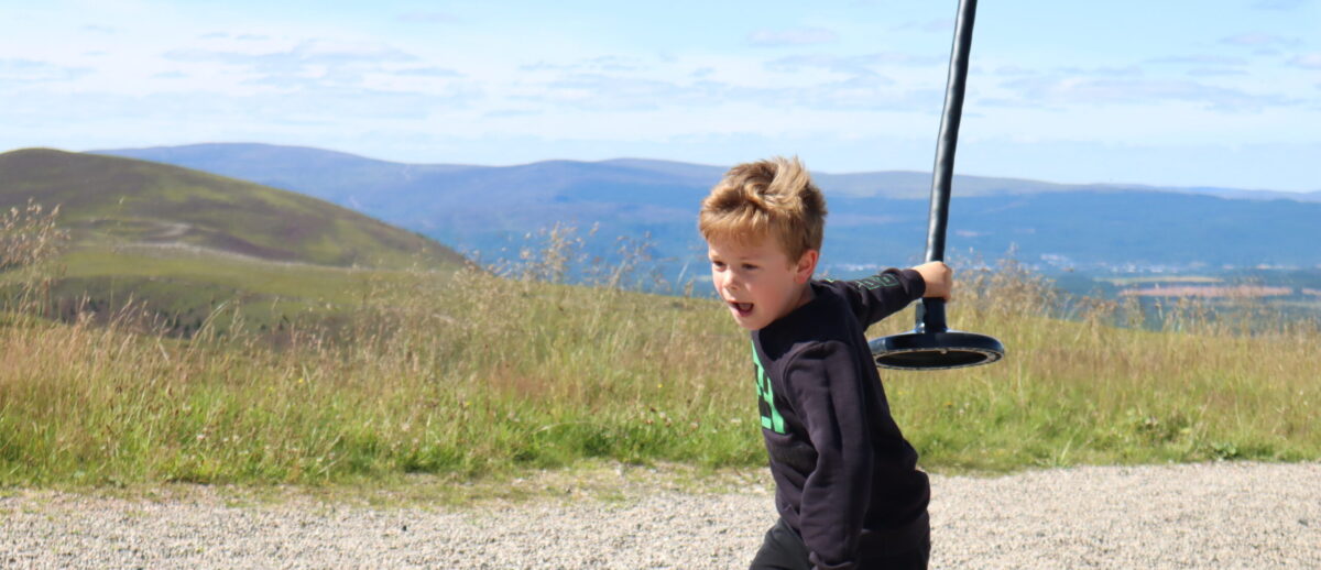 Boy at zip line at Cairngorm Mountain