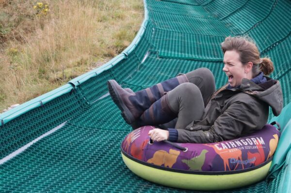 woman on tubing slide at Cairngorm Mountain