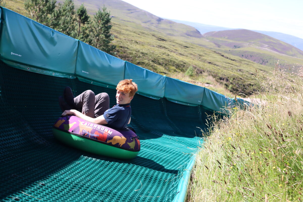 Cairngorm Mountain staff member on tubing slide